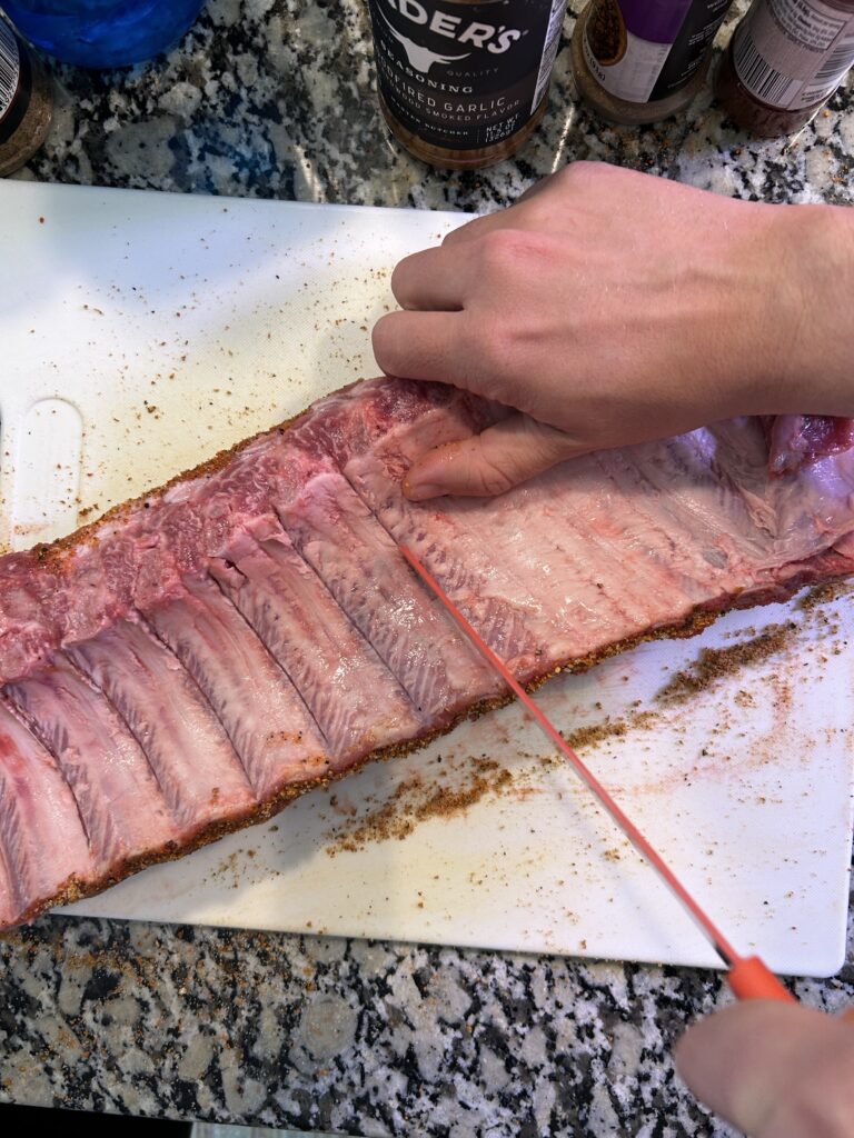 cutting through membrane on the bottom of a rack of ribs