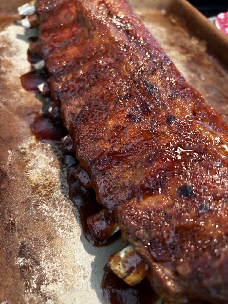 close up of caramelized BBQ ribs after broiling