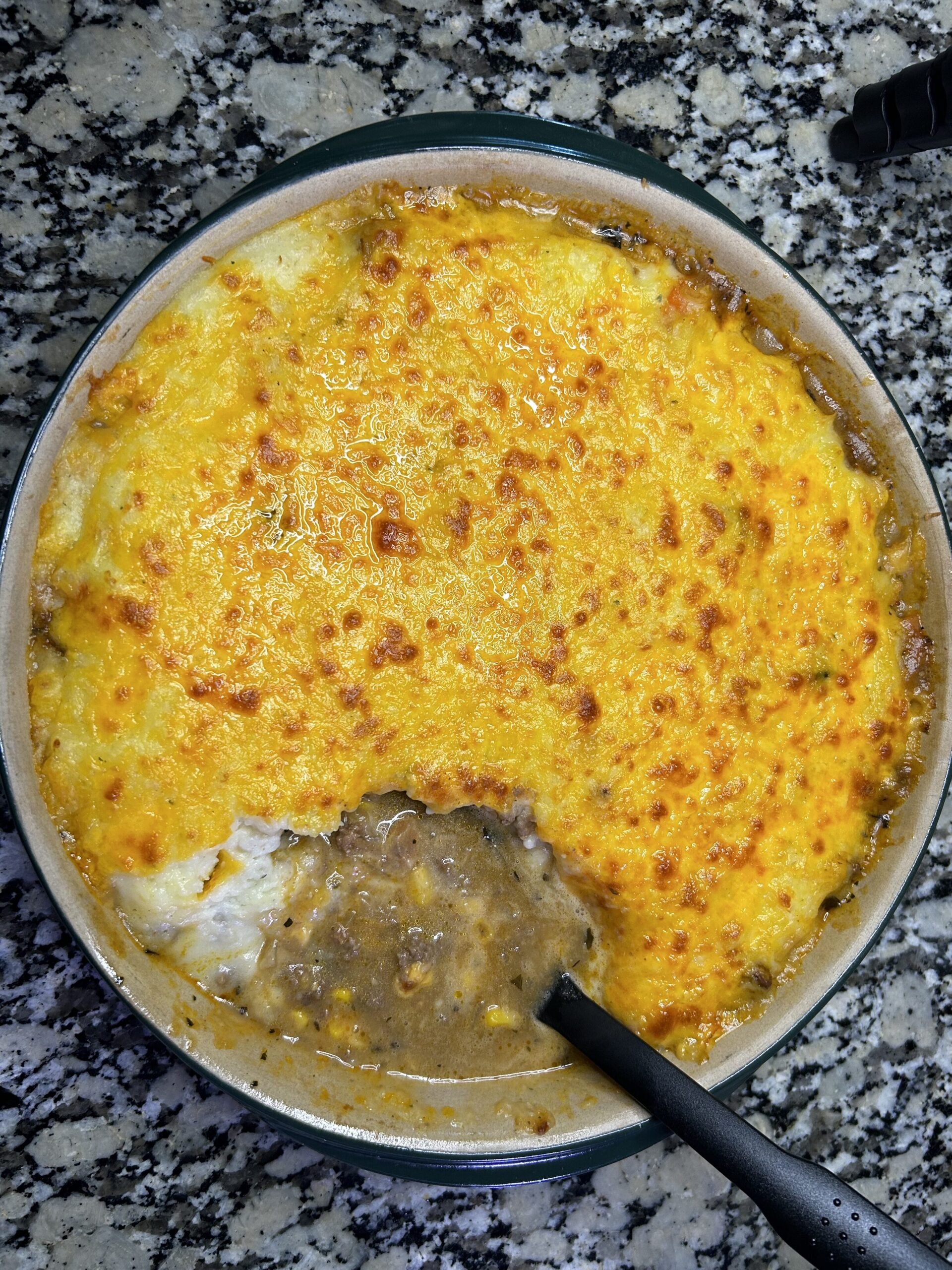 Shepherds pie with spoon ready to serve