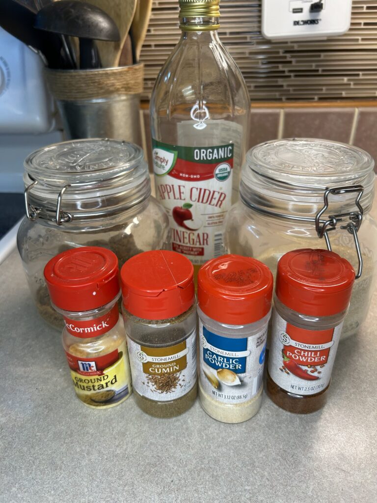 apple cider vinegar, brown sugar, white sugar, ground mustard, cumin, garlic powder, chili powder