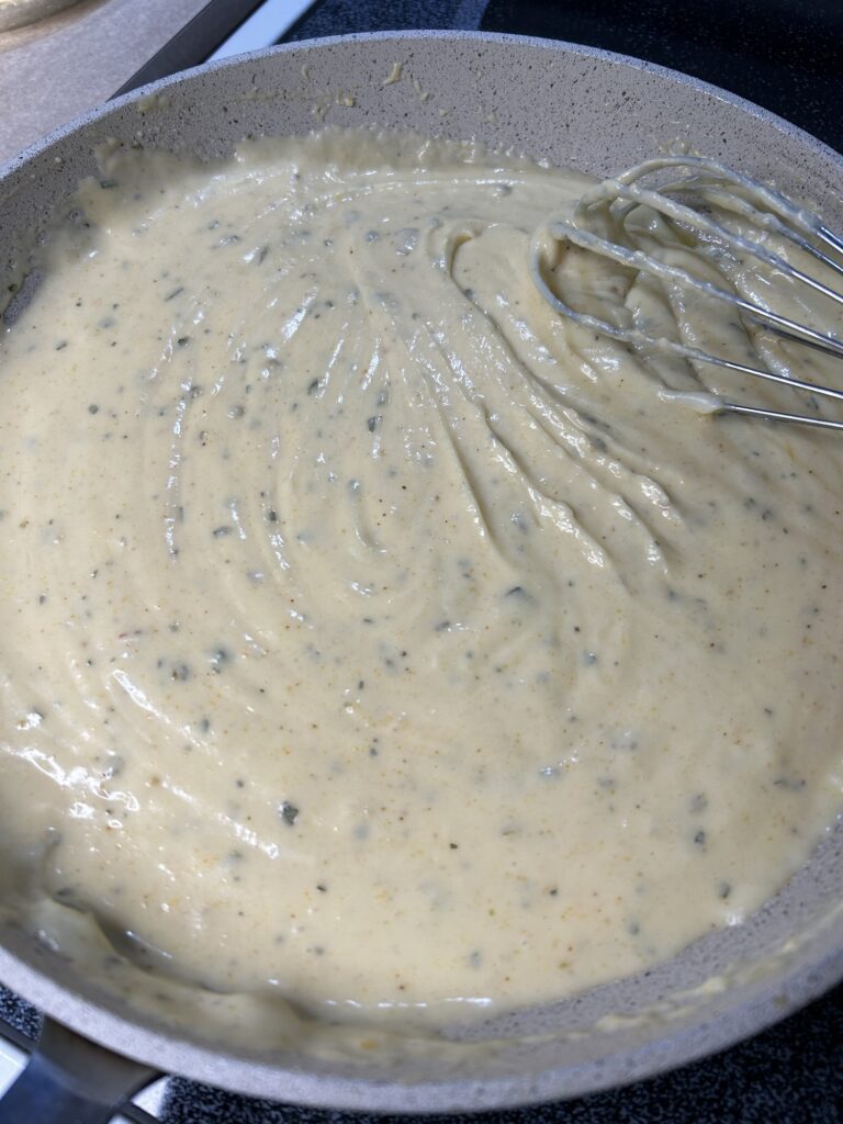 roux in a skillet being whisked