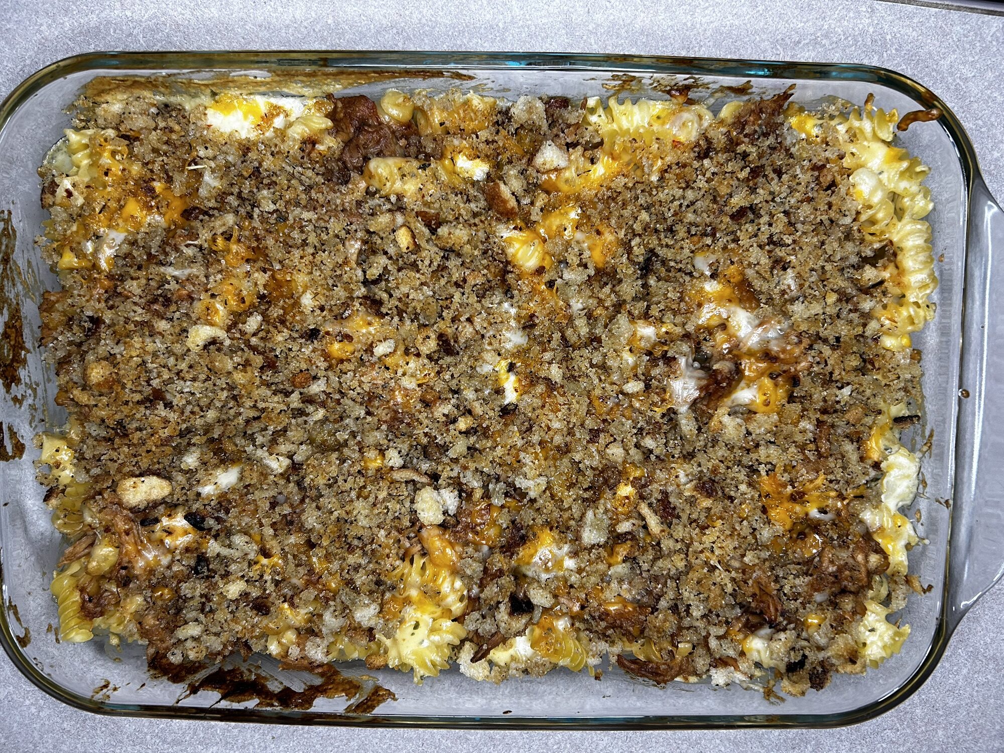 baked pulled pork mac and cheese in a dish