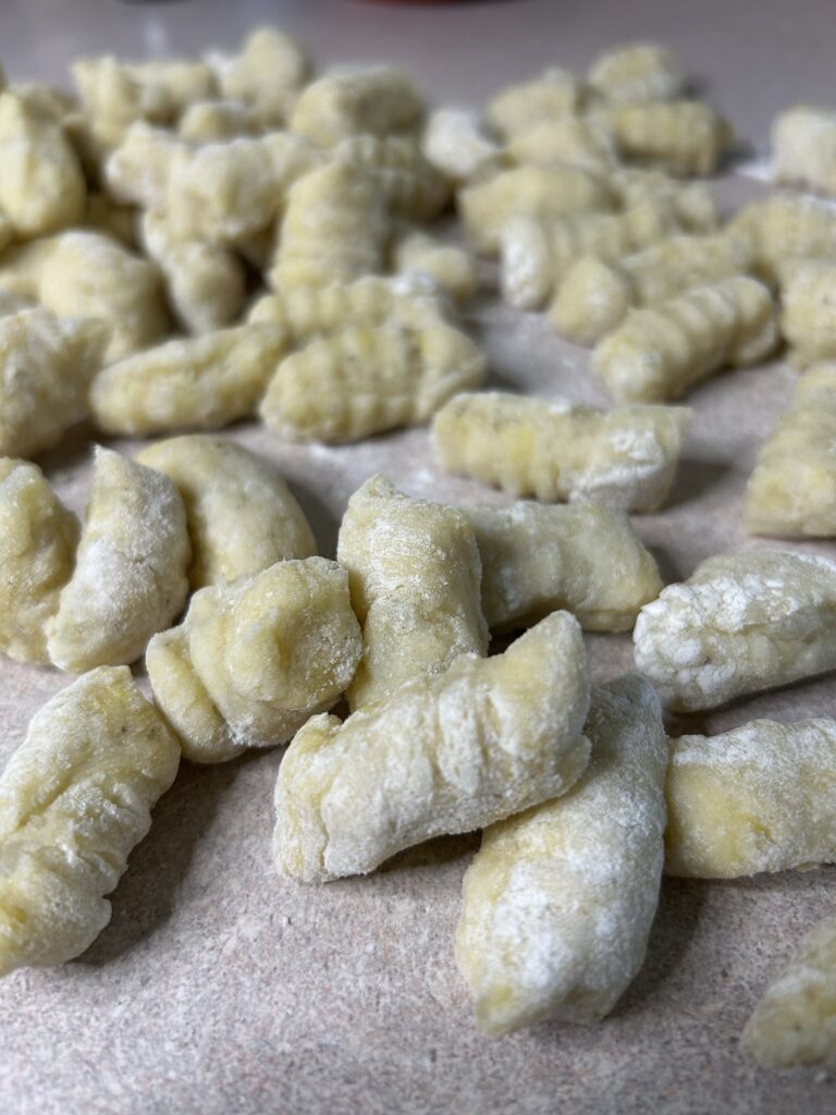 floured potato gnocchi sitting on counter